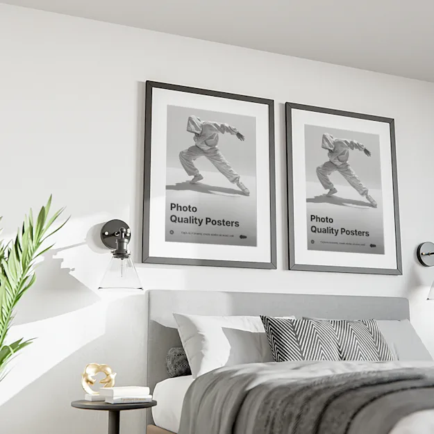 Two framed photo quality posters displayed above a modern bed in a stylish bedroom, featuring black and white images of a dancer in motion with the text