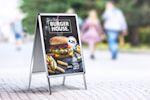 A banner highlighting outdoor printed pavement signs available at Helloprint with custom printing options for a cheap price