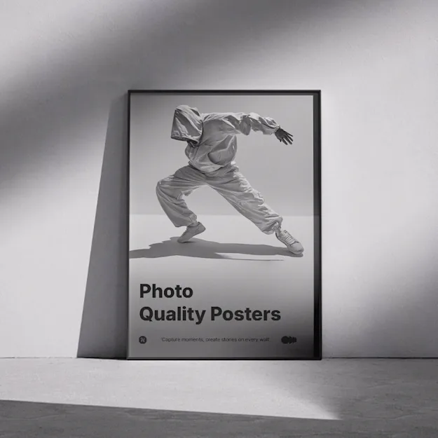Framed photo quality poster leaning against a wall, featuring a black and white image of a dancer in motion with the text