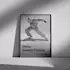 Framed photo quality poster leaning against a wall, featuring a black and white image of a dancer in motion with the text