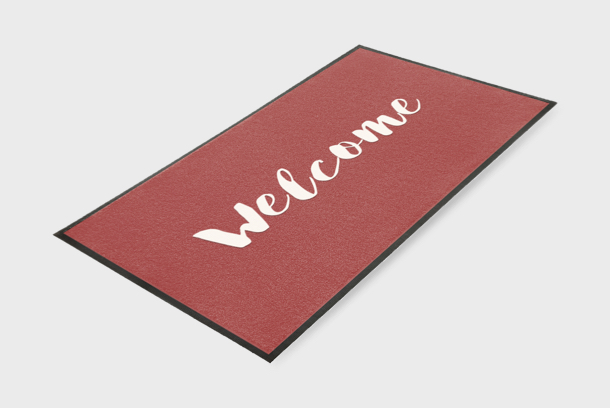 Image of entrance mat with welcome printed in white. Great for your business or home!