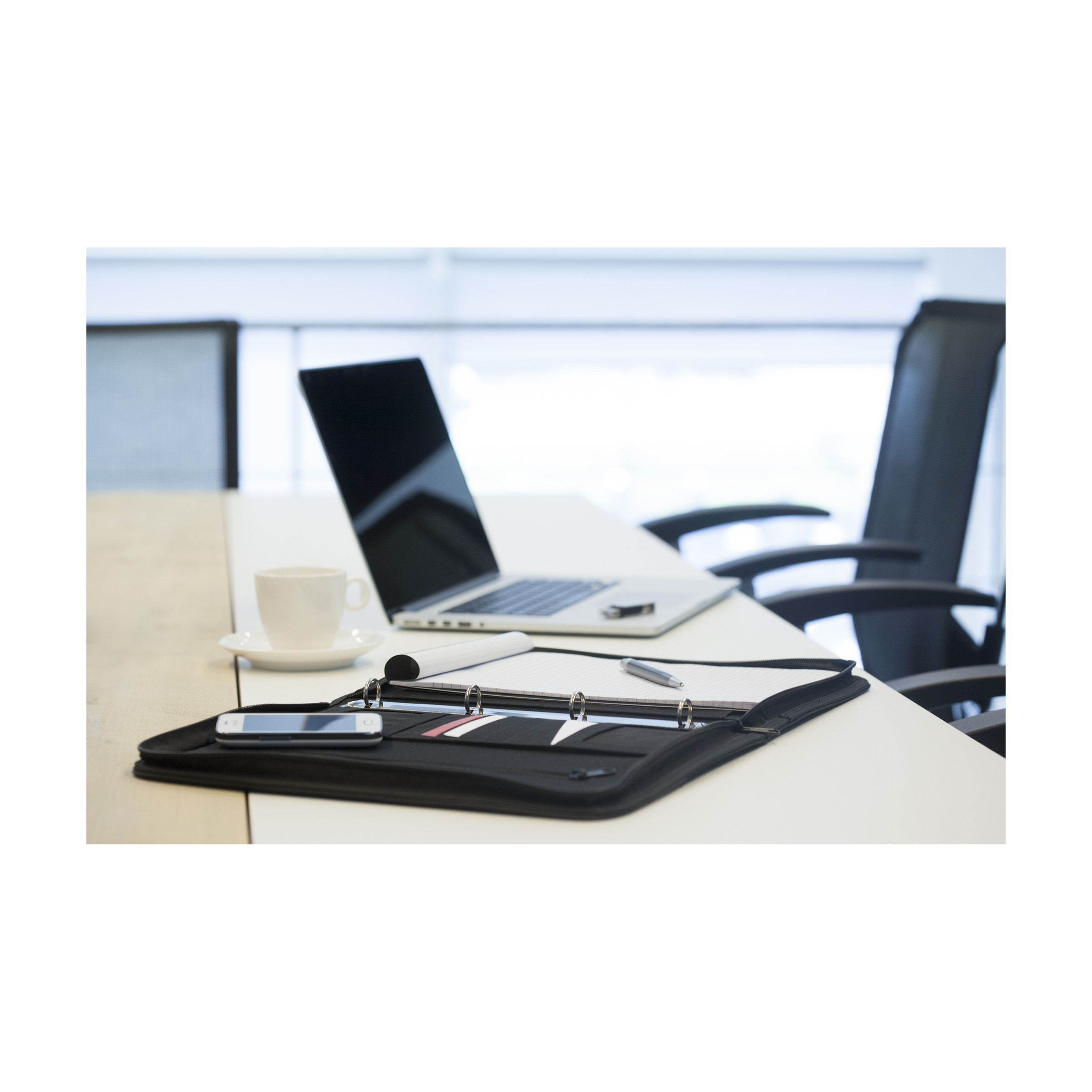 Document folder placed open on a working desk for easy access. The document folder is personalised with Helloprint.