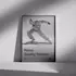 Framed photo quality poster leaning against a wall, featuring a black and white image of a dancer in motion with the text 